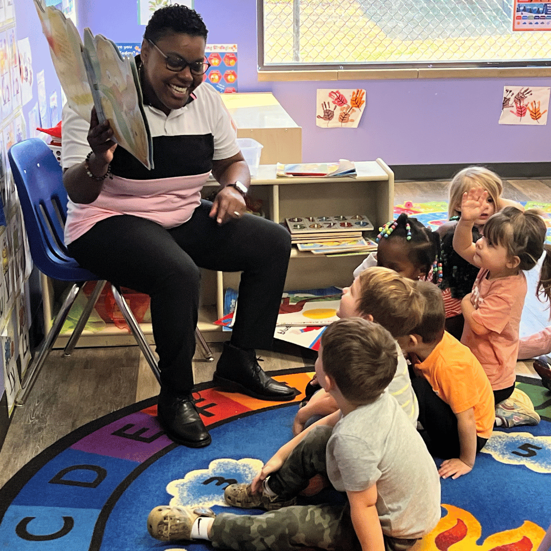 Annual Report 2023-2024: teacher reading to preschool kids