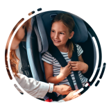 car Seat Safety: young child getting their car seat straps on