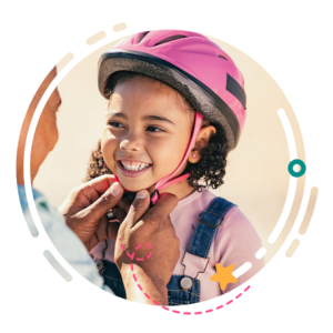 Bike safety: girl in pink bike helmet