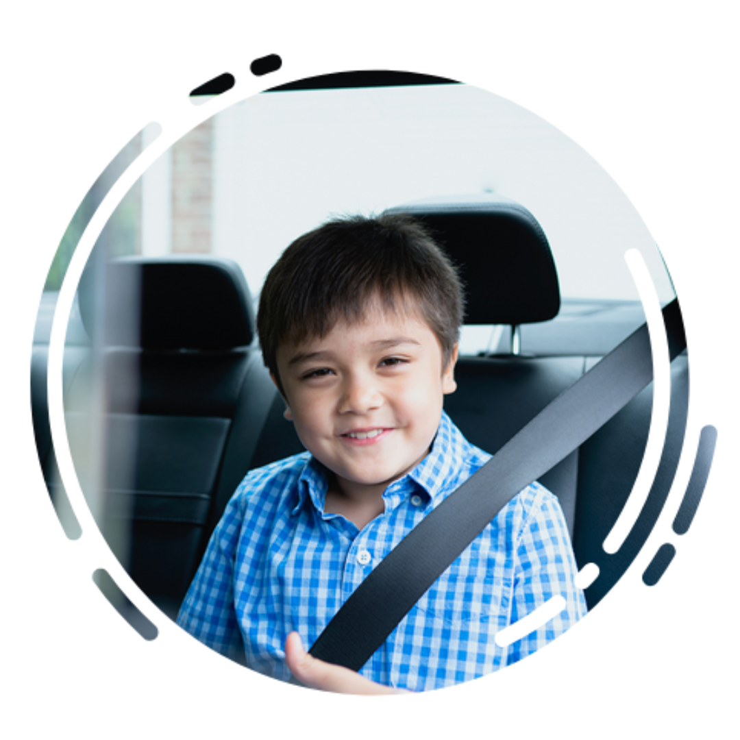car safety: boy with should belt on in car